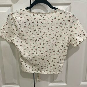White shirt with pink flowers wrap around shirt size medium